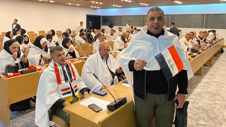 Sadrists' parliament members coming to the first session of the Iraqi parliament wearing white fabric used to bury the dead, Jan. 9, 2022. (Photo: Kurdistan 24)